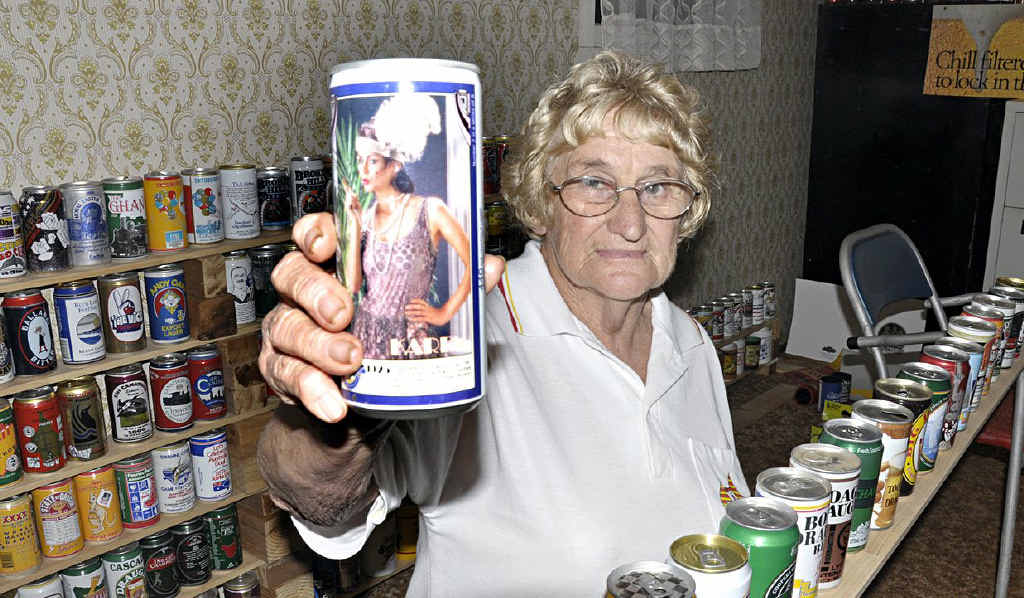 Crows Nest collector Joyce McKenzie celebrates the 77th birthday of the beer can. Crows Nest collector Joyce McKenzie celebrates the 77th birthday of the beer can.